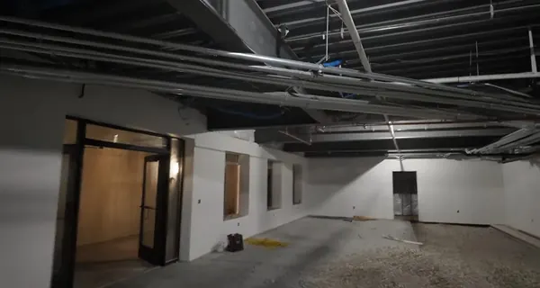 Commercial rough-in plumbing and drain layout inside an unfinished building for Tolleson plumbing homepage