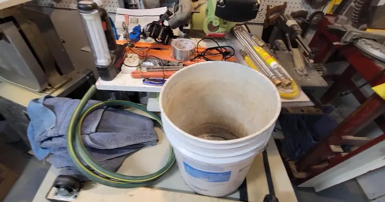 Drain cleaning equipment working through a clogged pipe or cleanout for Hard Water and Drain Cleaning in Tolleson: Why Snaking Doesn't Fix the Real Problem
