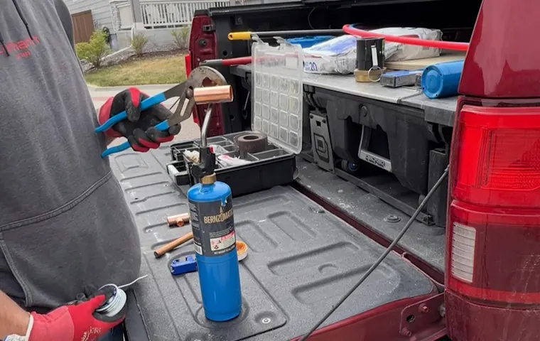 Sink faucet and drain connection being adjusted under a cabinet for Plumber Serving Youngtown, AZ in Tolleson